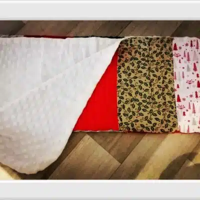 Couverture patchwork tissus thème Noël