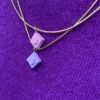 Collier pendentif brique de Lego® mauve et rose pale