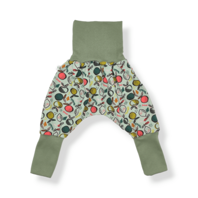 sarouel évolutif bébé et enfant en jersey bio avec des agrumes colorés sur fond vert menthe