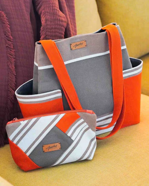 Sac en toile gris et orange poches latérales avec sa trousse