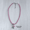 Collier kumihimo rouge, violet, rose métallisé, et son double charm en argent.