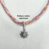 Collier kumihimo violet, orange et doré, et son double charm en argent.
