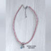 Collier kumihimo violet, orange et doré, et son double charm en argent.