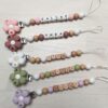 attache tétine clip fleur