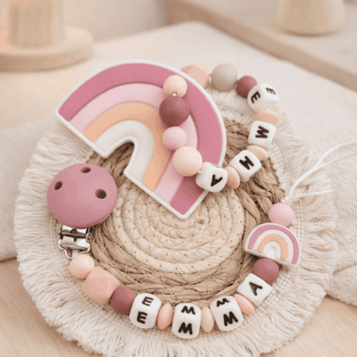 ensemble attache tétine anneau dentition arc en ciel rose