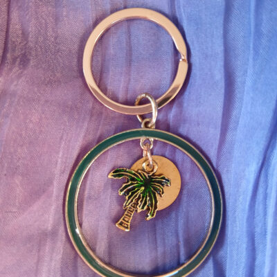 Porte-clé anneau doré motif vacances soleil et palmier