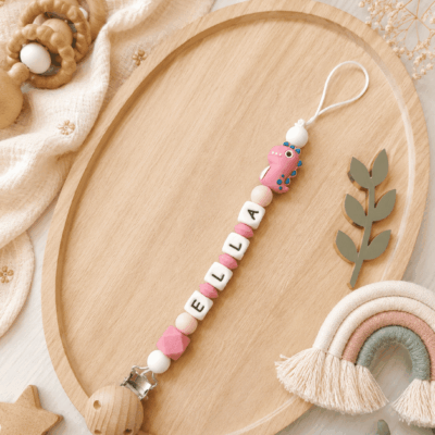 attache tétine dinosaure rose