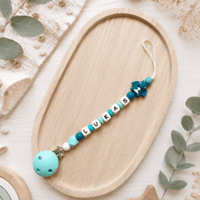 attache tétine dragon turquoise