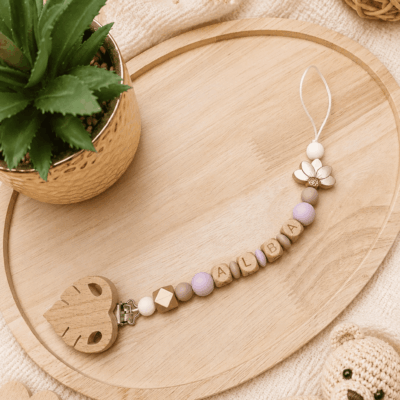 attache tétine fleur lotus or mauve
