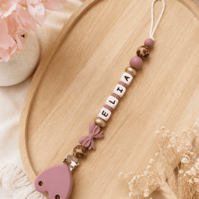 Attache tétine noeud rose léopard