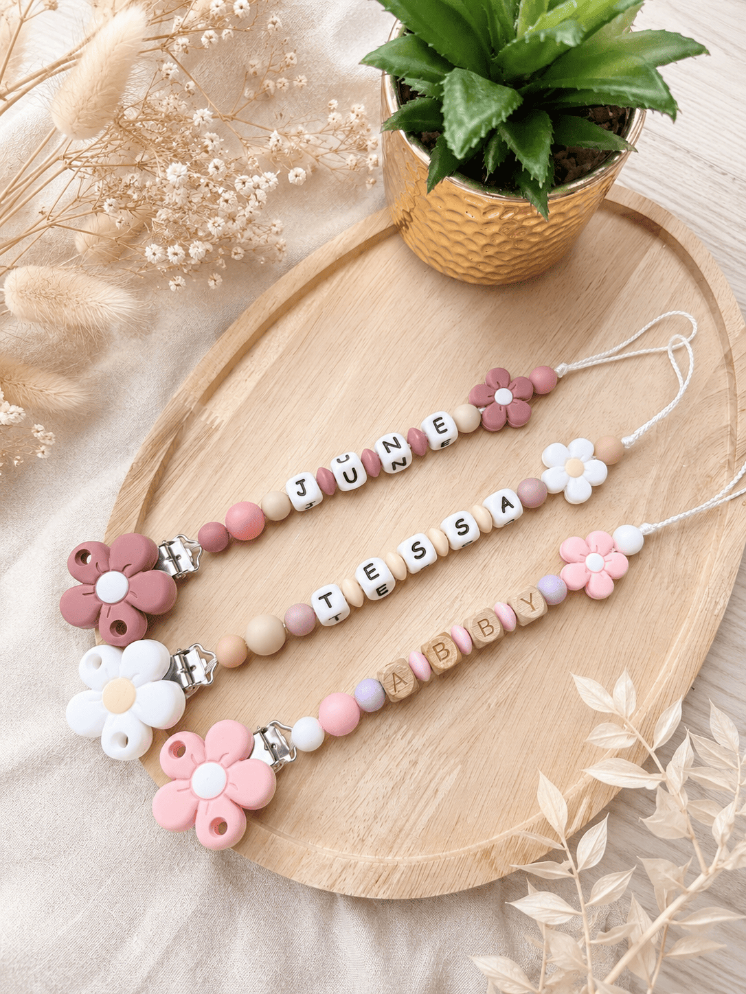 attache tétine fleur