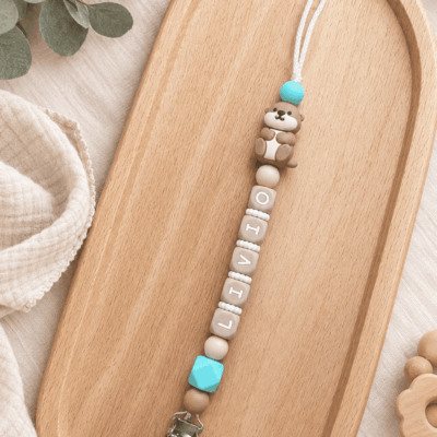 attache tétine loutre